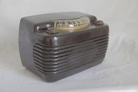 Side front angle view of Philco 'Hippo' radio showing brown/black Bakelite case and dial with knobs