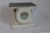 White metal Universal Bath Scale with rectangular platform and circular dial with label