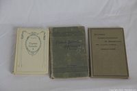 Three vintage books laid side by side: 'Eugénie Grandet' by Balzac in decorative off-white hardcover, 'Public Speaking' with green worn hardcover, and 'Business Correspondence in English' with soft greenish-gray cover.