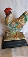 Full side view of the vintage ceramic chicken figurine showing detailed feather texture and colors