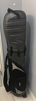 Front side view of Bag Boy hybrid travel cover showing textured hard-shell surface and storage compartments.