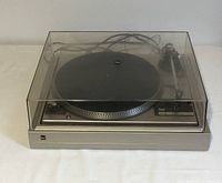 Front angled view of Dual CS 505-1 turntable with dust cover closed, showing overall condition and setup.