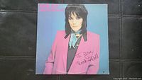 Signed Joan Jett & The Blackhearts vinyl album cover, close up showing autograph and image.