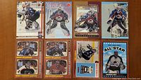 Photo showing eight hockey cards of Patrick Roy laid out, some in Montreal Canadiens and Colorado Avalanche kits, including multicolored backgrounds and player action poses.