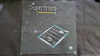Front cover of the vinyl album 'Crime of the Century' by Supertramp, showing artwork and title.