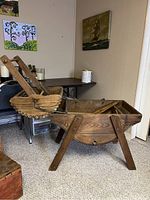 Side view of antique wooden wash tub and hand-cranked wringer.
