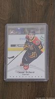 Front side of the Conner McDavid Young Stars hockey card in protective casing showing player image and team details.