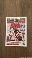 Front of Dominik Hasek rookie hockey card showing him in Chicago Blackhawks goalie gear.