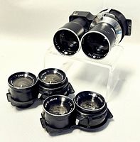 Five lens board units on clear acrylic stand