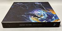 Box set outer cover with artwork depicting Earth and dark space, with abstract stylized shapes