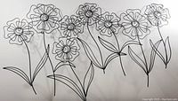 Full view of large metal floral wall decor showing nine wireframe flowers and leaves.