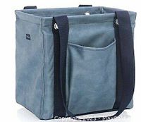 Front and side view of the small utility tote bag showing denim distressed fabric, black straps, and front pocket.