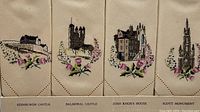 Four embroidered linen tea napkins displayed side by side featuring Scottish landmarks and floral embroidery: Edinburgh Castle, Balmoral Castle, John Knox's House, Scott Monument.