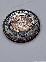 Reverse side showing Parliament House with '1927' date and ornate scrollwork