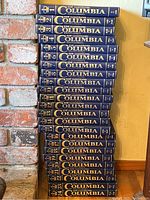 Complete set of 24 volumes of the New Illustrated Columbia Encyclopedia from 1979 stacked vertically with visible spines.