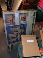 Photo of original boxed Greenleaf wooden dollhouse kit labeled as "The Prince" with images of the assembled dollhouse on the packaging.