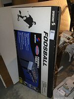 Photo of the boxed Sportcraft Foosball Table showing brand and model on the package.