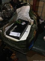 Large bag containing stamp books and loose stamps, including Blue Ribbon stock book and Kenmore catalog.