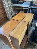 Overhead view of four wooden-cabinet speakers grouped together