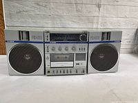 Full front view of Fisher PH-422K stereo boombox showing dual speakers and central cassette player.