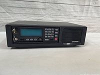 Front view of Harris SP721 Remote Desktop Controller showing LCD screen, keypad, speaker, and controls.