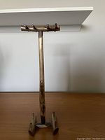 Vintage wooden desk lamp stand with small shelf on top, four pegs, vertical post, natural wood finish