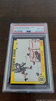Front view of 1991 Score Bobby Orr Stanley Cup Hero hockey card encapsulated with PSA 8 grade label visible