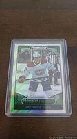 Front view of a Parkhurst Prominent Prospects Cole Caufield rookie hockey card in plastic protective case showing him in Montreal Canadiens uniform.