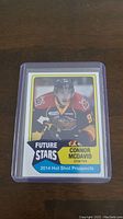 Front view of Connor McDavid pre-rookie hockey card labeled 2014 Hot Shot Prospects Future Stars with player in hockey gear.