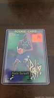 Kevin Garnett rookie card in plastic sleeve with RC sticker on top right