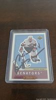 Front of Upper Deck rookie hockey card of Marian Hossa showing autograph and player image in Ottawa Senators uniform