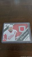 Front image of the Steve Yzerman game jersey card showing the player image and embedded fabric swatch.