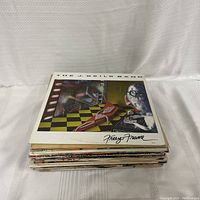 Stack of 25 vinyl records showing the top album 'Freeze Frame' by The J. Geils Band