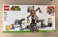 Front of box showing the complete LEGO set assembled with Reznor figure and platform.