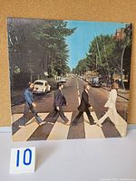 Front cover of Abbey Road album showing the Beatles crossing the street, in original shrink wrap.
