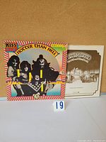 Front cover of KISS Hotter Than Hell vinyl LP album with band members pictured.