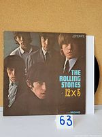 Front cover of the vinyl LP '12x5' showing band members and title