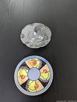 Top view of both dishes showing silver overlay floral glass dish and colorful handpainted dish