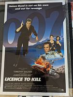 Photo of the James Bond 007 Licence to Kill original movie poster showing full artwork and condition inside protective plastic sleeve.