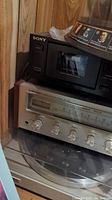 Close-up of Sony cassette player stacked above Pioneer SX-450 receiver and PL-514 turntable.