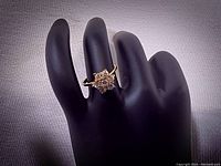 Full front view of ring on display hand