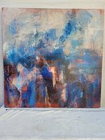 Front view of the abstract art canvas showing blue and copper textured paint.