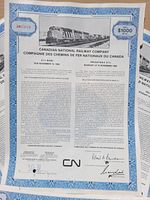 Close-up image of a single Canadian National Railway Company $1000 8% bond, showing details of the bond including text, signatures, and train image.
