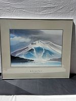 Framed watercolor print of Whistler Mountain showing snow, blue sky, and dark foreground with sailboats.