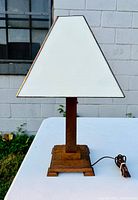 Front view of the Mission oak lamp with white stained glass shade showing overall shape and wood base.
