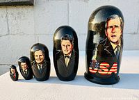 Set of five USA Presidential Matryoshka dolls arranged largest to smallest showing detailed presidential portraits