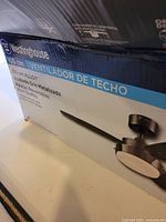 Box showing Westinghouse branding and model details, indicating 105 cm alloy reversible blades and metallic finish.