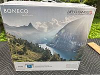 Box of Boneco Air-O-Swiss Healthy Air Model 7135 Ultrasonic Humidifier showing scenic mountain and lake photo and branding details.