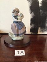 Full figurine view on wooden base with number 18 marker