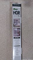 Box showing front with product brand HOR gordijn and images of door mesh installation